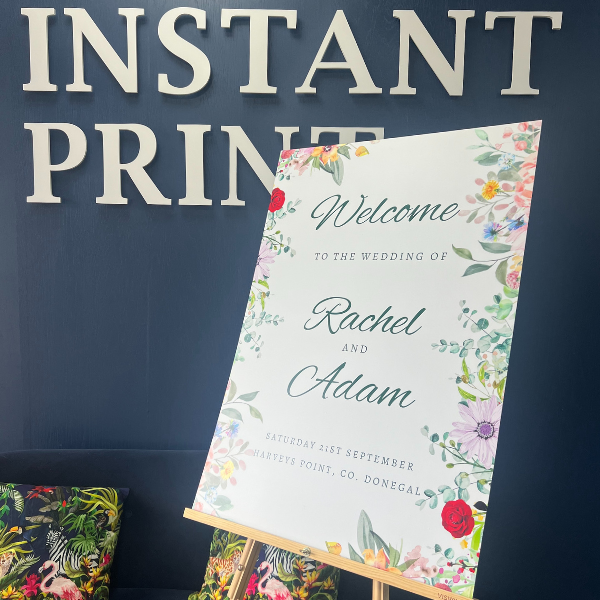 floral foamex wedding board infornt of instant print wall